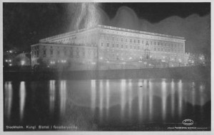 The Royal Palace lit up at night. From a WWII era postcard, worn by 67 years in an old scrapbook.